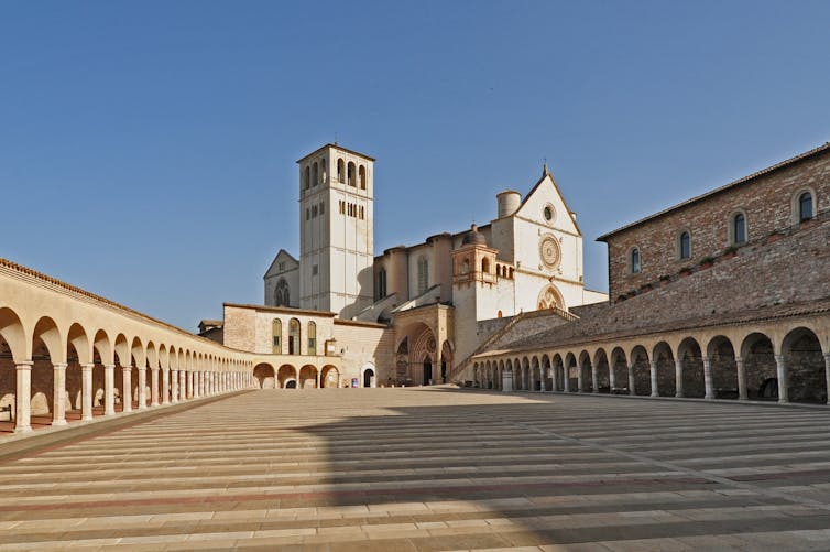 A beautiful Italian basilica against a bright blue sky.