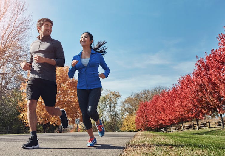 Man and woman jogging together.