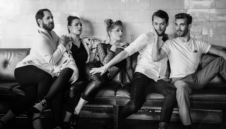 Black and white photo of five actors