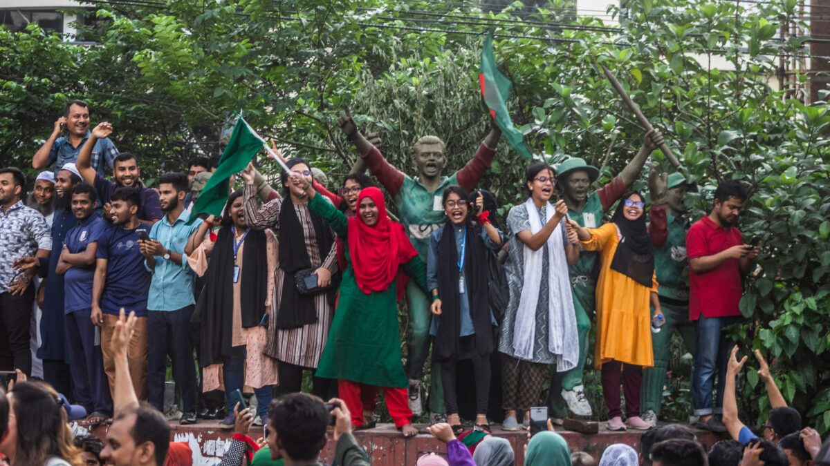 A group of youth celebrating the resignation of the Prime Minister Sheikh Hasina after the July revolution. Photo by Bornil Amin on Unsplash. Used under an Unsplash licence.