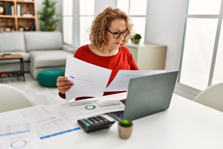 A business woman hard at work at her desk.