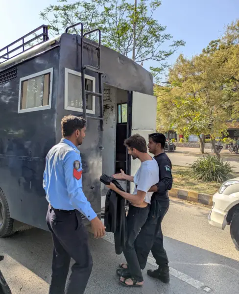 Police arresting an individual. Image by Ramna Saeed.