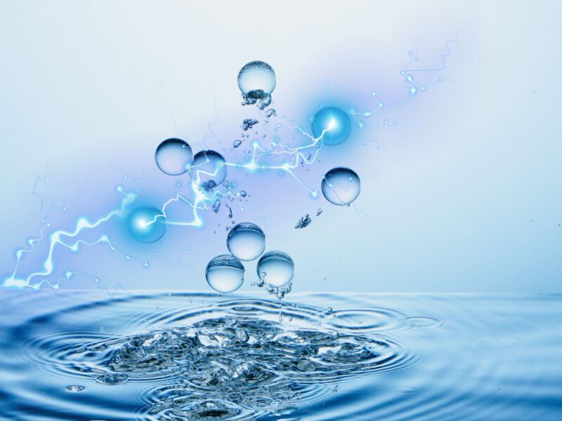 ElectRically charged droplets arise from ripples of water. 