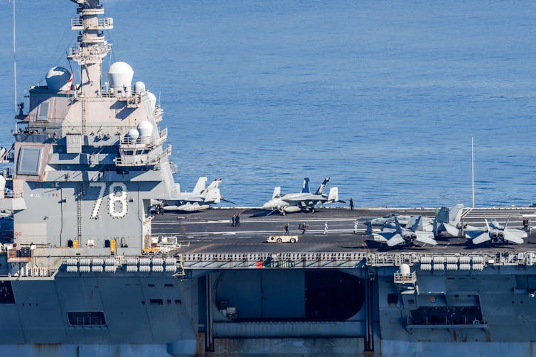 A large military ship is seen at sea.
