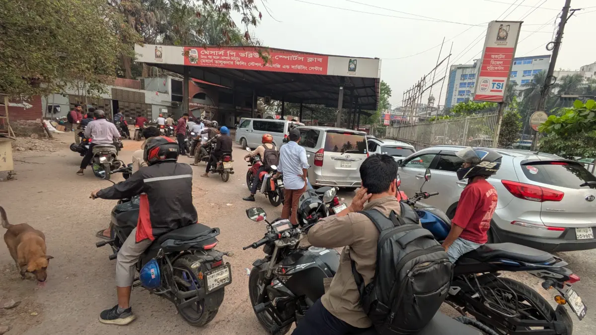 Motorists queue at a Dhaka fuel station on March 9, 2026, during government-imposed rationing that left delivery riders and commuters waiting hours to purchase limited fuel supplies. Photo: Zulker Naeen.