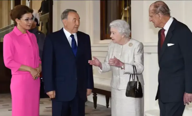 Kazakh President Nursultan Nazarbayev and his daughter Dariga Nazarbayeva, who served as deputy prime minister, meet Queen Elizabeth and Prince Philip in 2015. Screenshot from YouTube; fair use. 