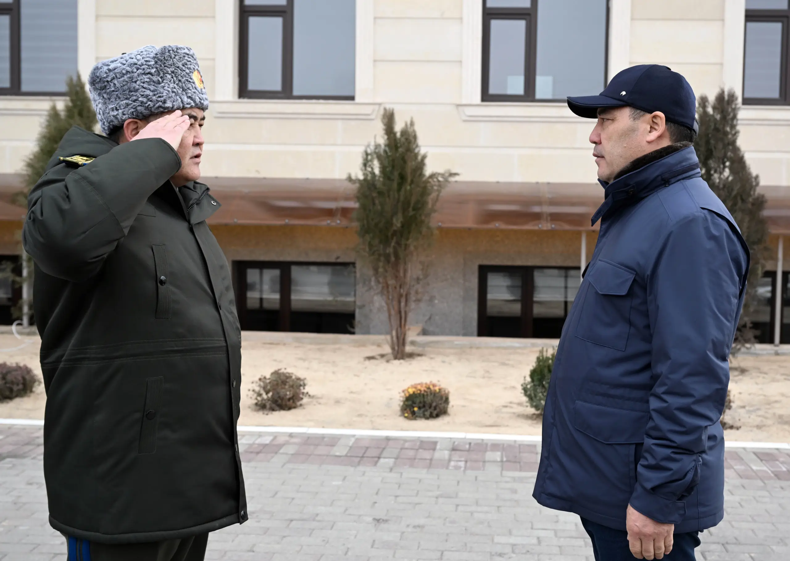 Former security chieft, Kamchybek Tashiyev (on the left) saluting president Sadyr Japarov (on the right). 