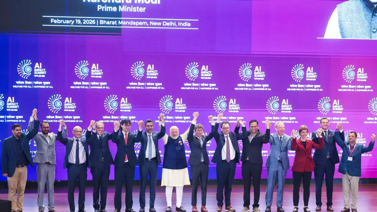 Indian Prime Minister Narendra Modi in a group photograph along with global tech leaders at the Opening Ceremony of India AI Impact Summit– 2026 at Bharat Mandapam, in New Delhi on February 19, 2026. Image via Wikipedia by the Prime Minister's Office, licensed under the Government Open Data License - India (GODL).