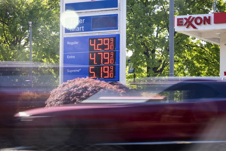 A gas station in the US showing high prices at the pumps.