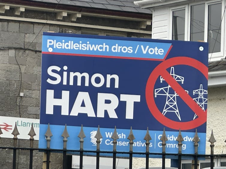A campaign sign in the 2024 General Election showing a pylon crossed out.