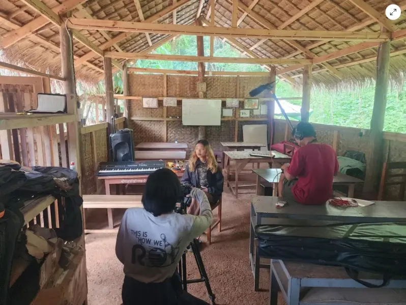 A woman journalist being interviewed.