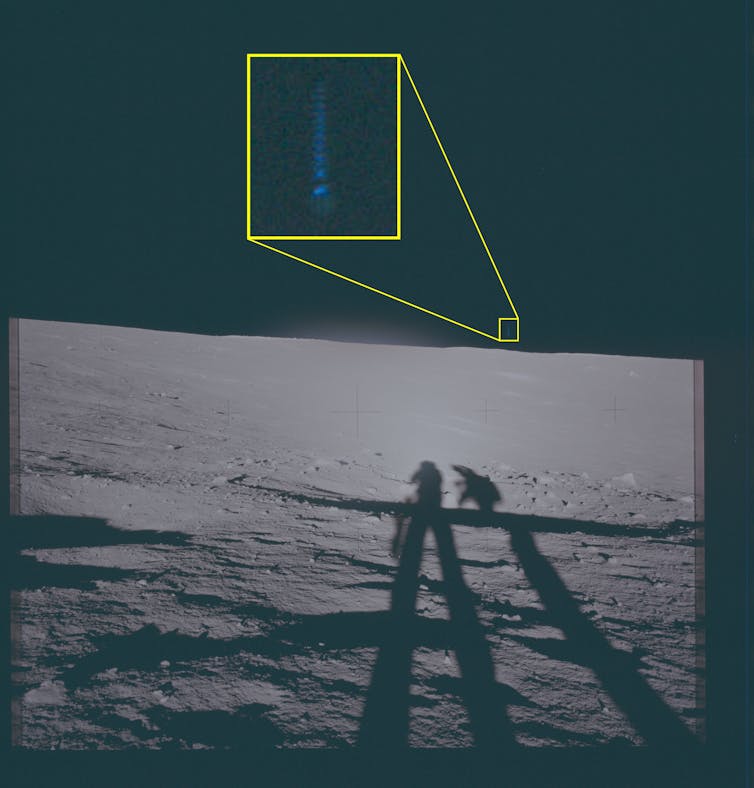 Lunar photo showing a small streak of light above the horizon.