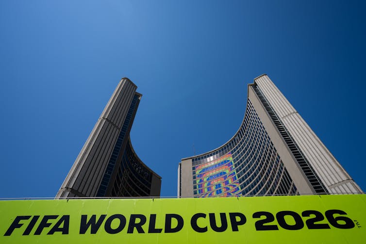 A sign that says FIFA World Cup 2026 is seen in front of a skyscraper
