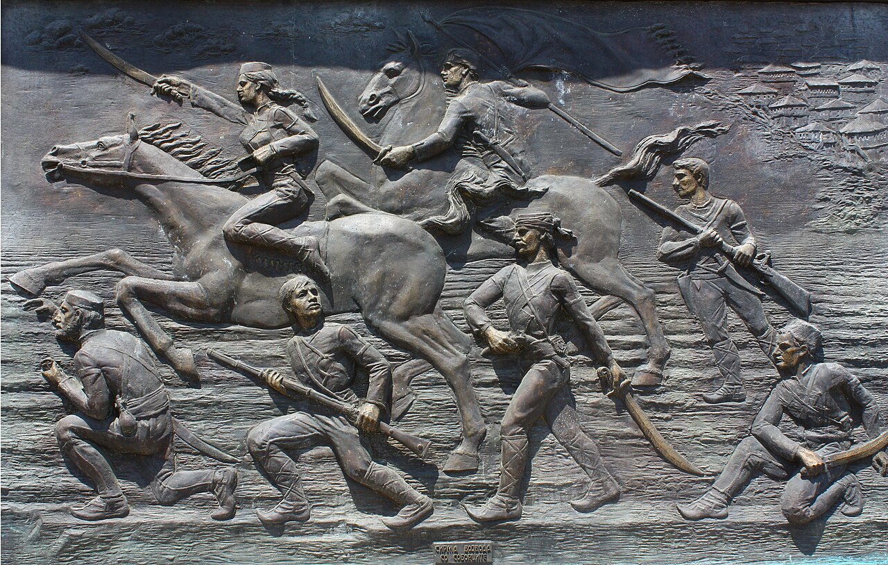 Plaque of Sirma Voyvoda (on horseback, first from left) and her troops in Skopje, North Macedonia. 