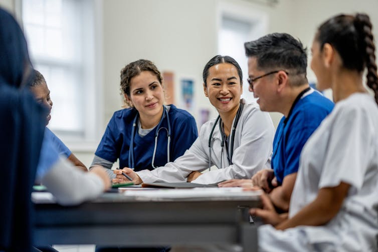 A group of medical students sits and talks.