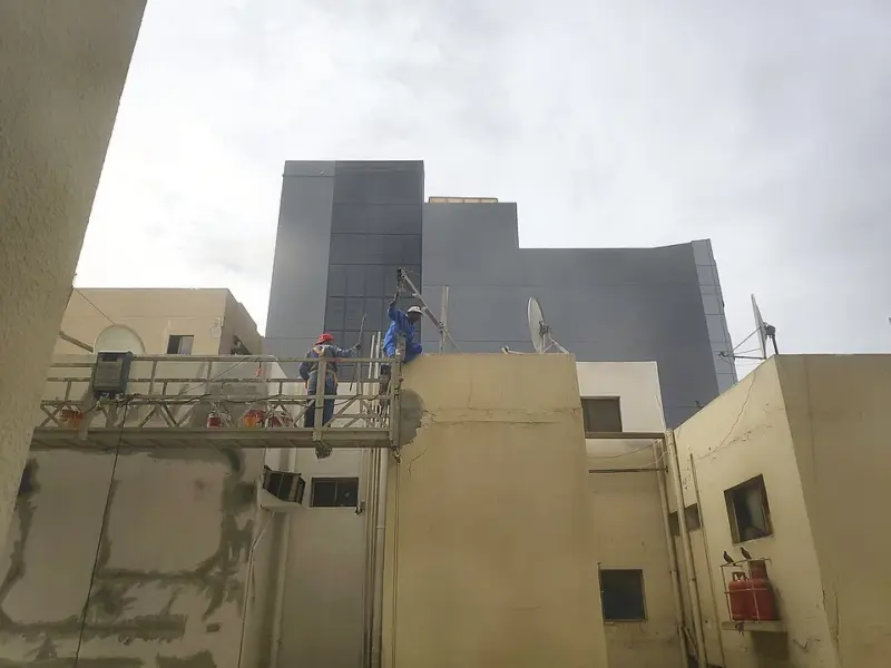 Migrant workers on a building in Bur Dubai, UAE, March 21, 2023. 