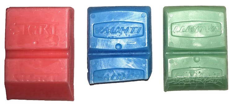 Three wax bars in different colors.