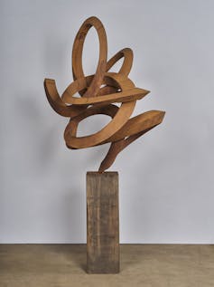 A steel sculpture in a squiggle shape.
