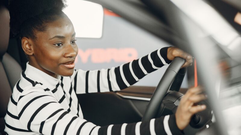 Black woman driving a car