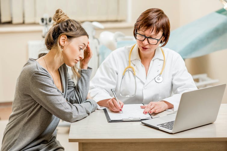 A young female patient with a health-care provider