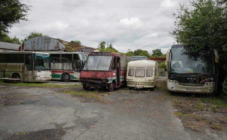 Abandoned buses at a petrol station in Wales