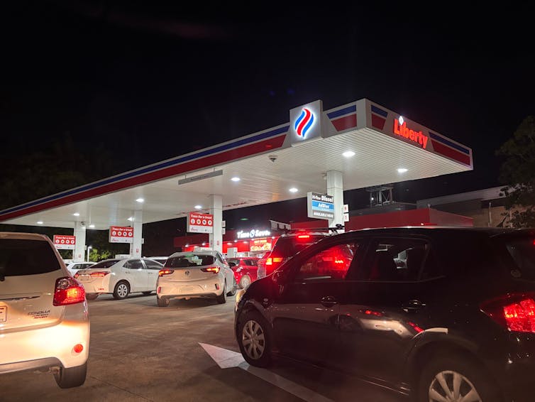 Several cars wait to fill up at a Brisbane petrol station.