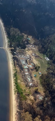 An aerial view of a destroyed community.