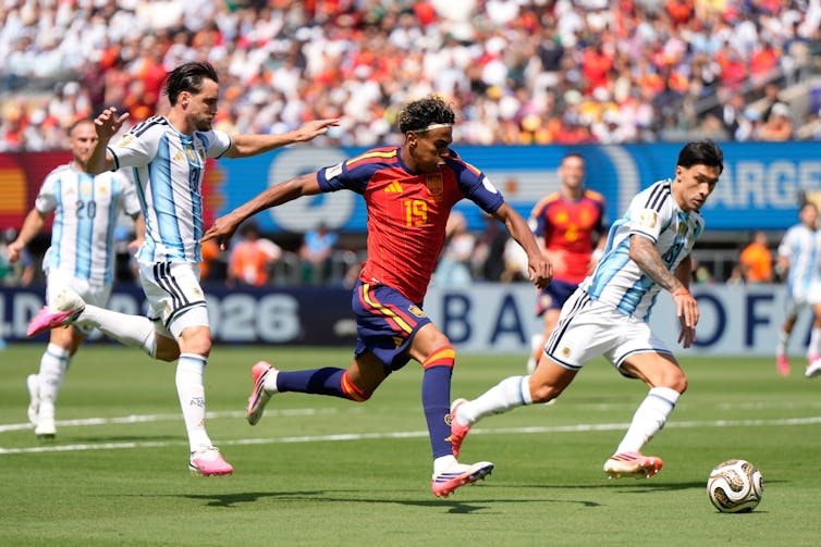 Spain's Lamine Yamal runs with the ball during the World Cup final.