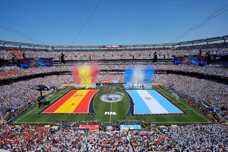 The Argentina and Spain flags are seen during the national anthems ahead of the World Cup final in New Jersey. (AP Photo/)