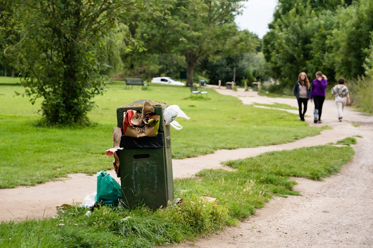 overflowing bin in green park