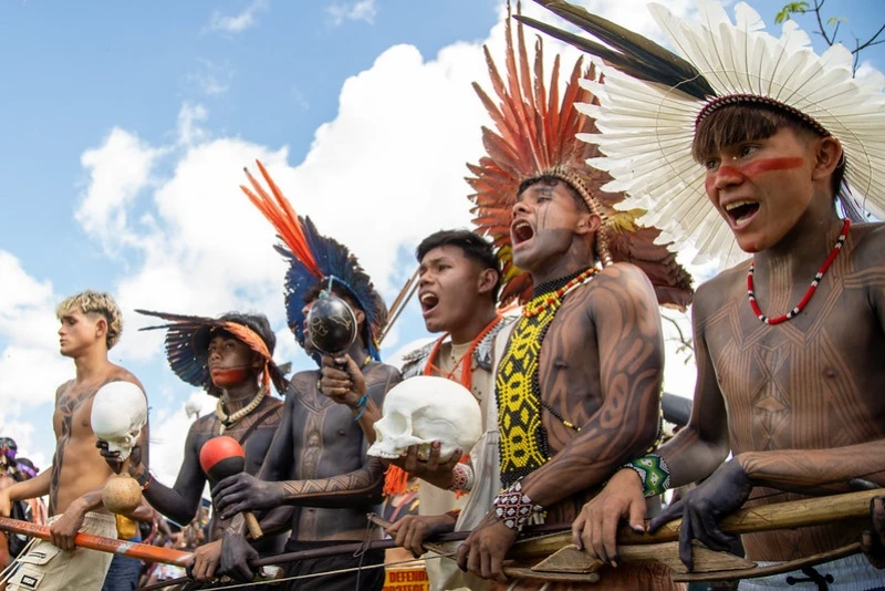 Indigenous people protest during the Free Land Annual Camp in Brasília, Brazil's capital, in April 2026, with fake skulls. Photo by Guilherme Cavalli/Cimi on Flickr, used with permission.