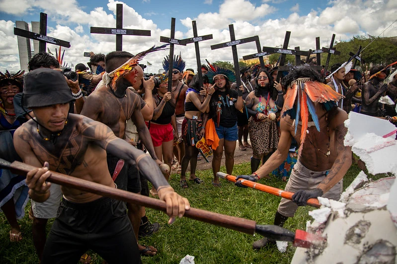 Indigenous people protest during the Free Land Annual Camp in Brasília, Brazil's capital, in April 2026, with giant skulls.