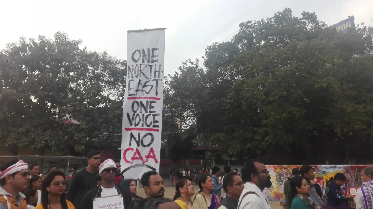 Anti-CAA Banner demonstrated at Cultural Protest organised by Artistes of Assam. 2019. Image via Wikipedia by Ankur Jyoti Dewri. CC BY-SA 4.0.