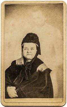The spirit photo of Mary Todd Lincoln. The 'ghost' of her husband has his hands on her shoulders.