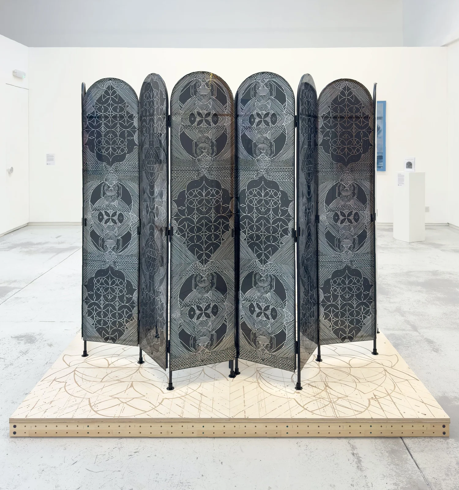 The Archive of Silence was created for the group show The Doorway Effect and exhibited at The Handbag Factory Gallery, London in 2025. Engraved plywood, MDF, timber, metal, UV print on acrylic sheet, magnet, one-way mirror sheet, two chairs, a table, a photo, an archival box. 210 x 210 x 185 cm. 2025. 