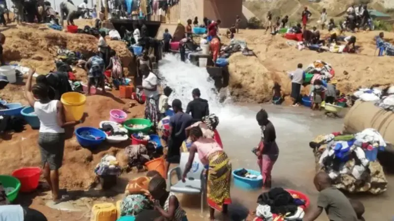 Lacking in drinking water, residents of the Kolwezi district use the water discharged from mining companies.