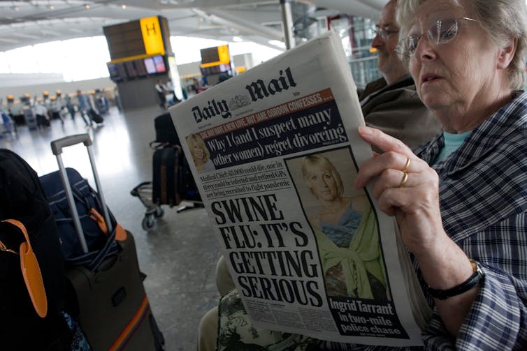 A woman reading the Daily Mail
