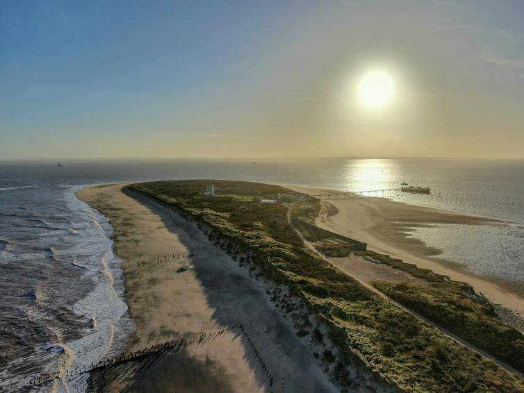 A view from the end of Spurn Point out to sea and against a sunrise