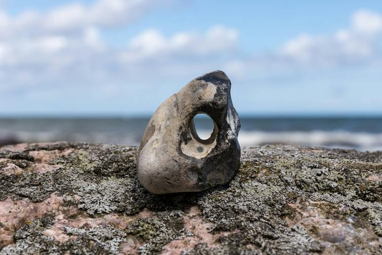 A hag stone by the sea