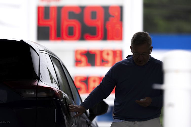 Fuel prices are displayed outside a gas station in Washington DC.