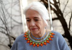 A woman's face gazing away from the camera.