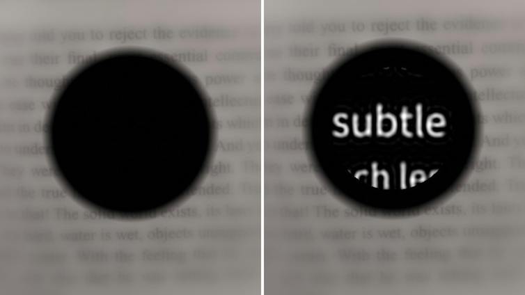 A simulated image showing how text in a book is readable for an AMD patient with PRIMA