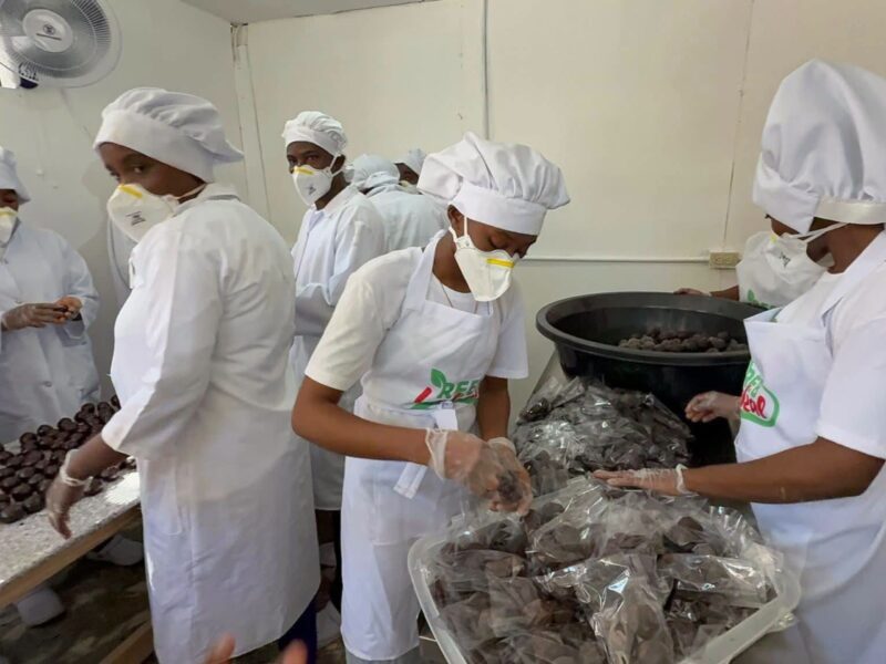 Workers packaging chocolate balls in the packing room. Photo courtesy Rébetha Charles, used with permission. 
