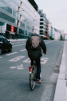 An elderly man cycling