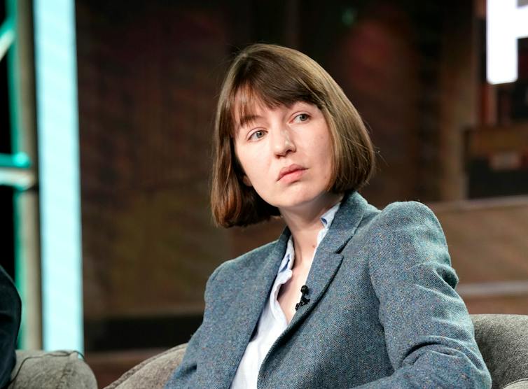 Photograph of Sally Rooney gazing to her left