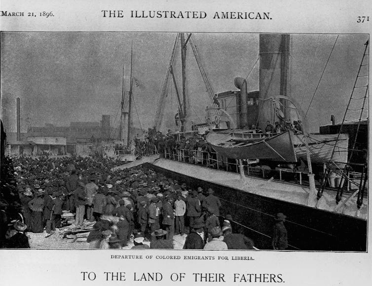 A crowd of people are seen next to a large ship.
