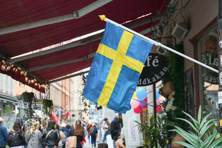The Swedish flag on a street in Stockholm's old town.